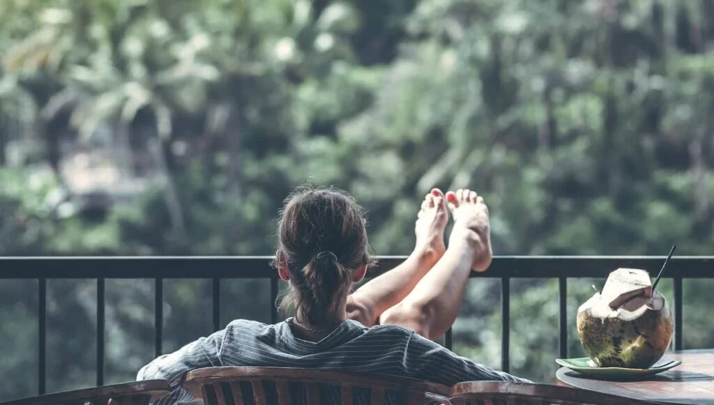 Woman-Sitting-on-Back-Porch-Yard-Patio-OnePoll